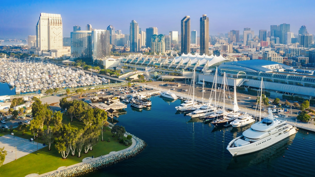 San Diego Convention Center with marina and city skyline in the background.