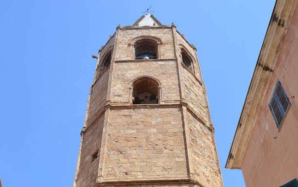 Bell tower in Alghero Historic Center, Sardinia, viewed from below.