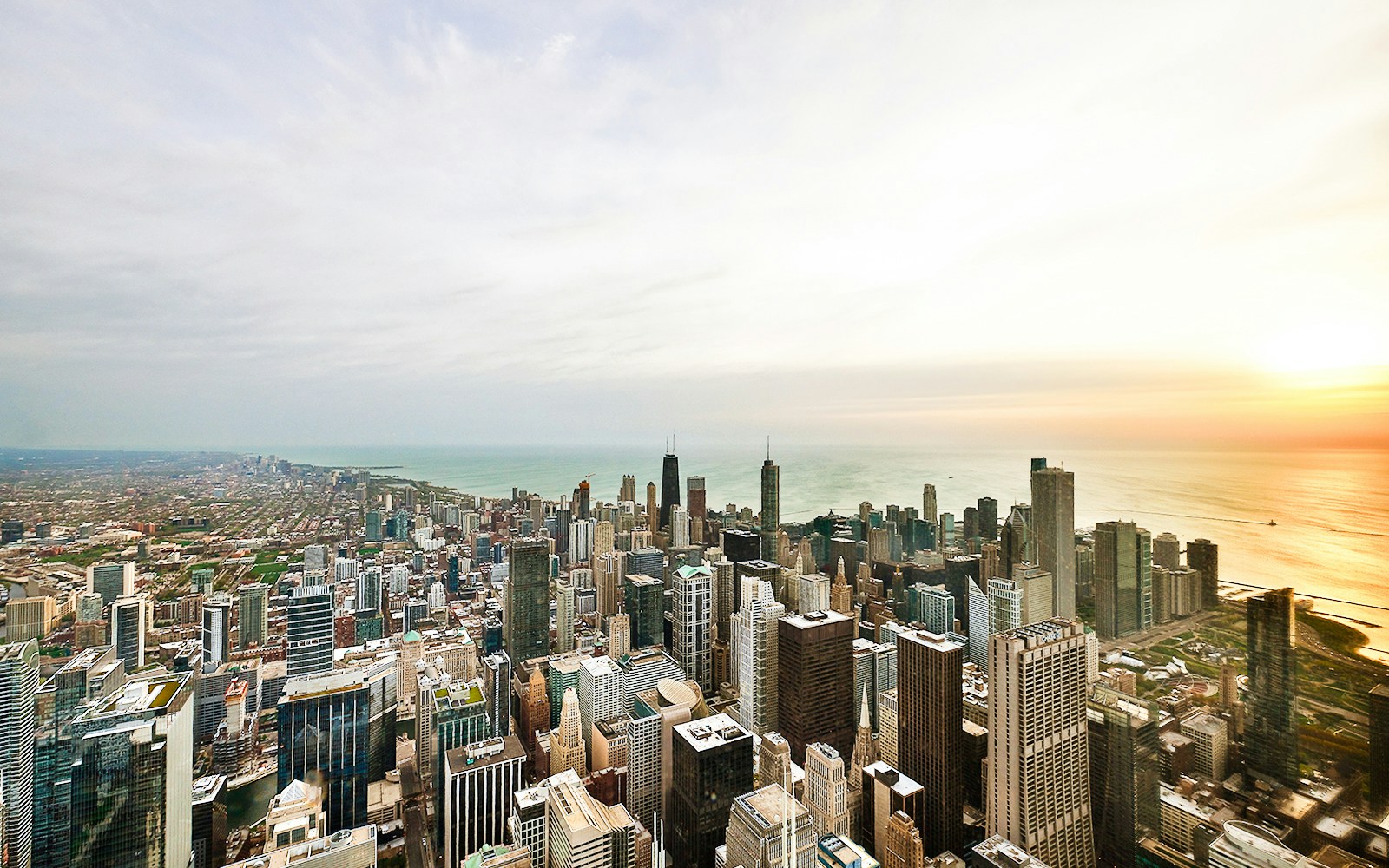 View from Skydeck at Willis Tower, Chicago, overlooking city skyline and Lake Michigan.