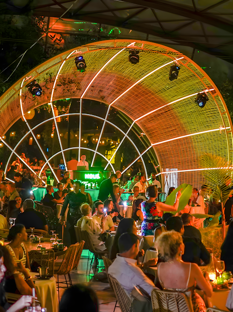 Performer entertaining guests at Nouba Restaurant Dinner Show.