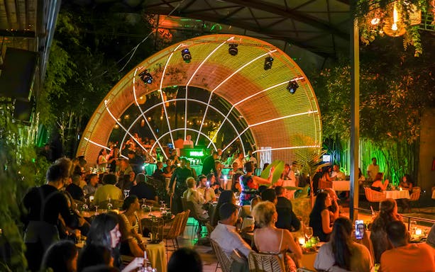 Performer entertaining guests at Nouba Restaurant Dinner Show.