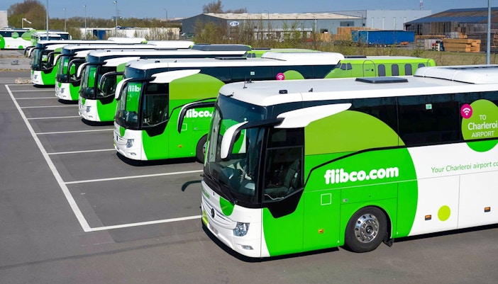 Flibco shuttle buses parked for airport transfer.