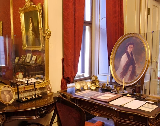 Vienna Sisi Museum interior with portraits and ornate furnishings.