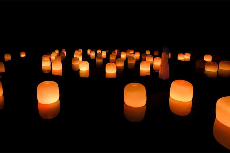 TeamLab art installation with floating spheres in Abu Dhabi exhibition space.