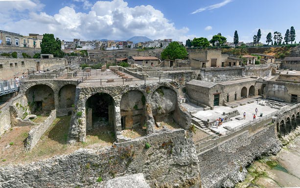 Herculaneum Ruins with ancient stone arches and preserved structures in Italy.
