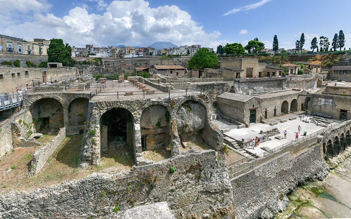 Herculaneum Ruins with ancient stone arches and preserved structures in Italy.
