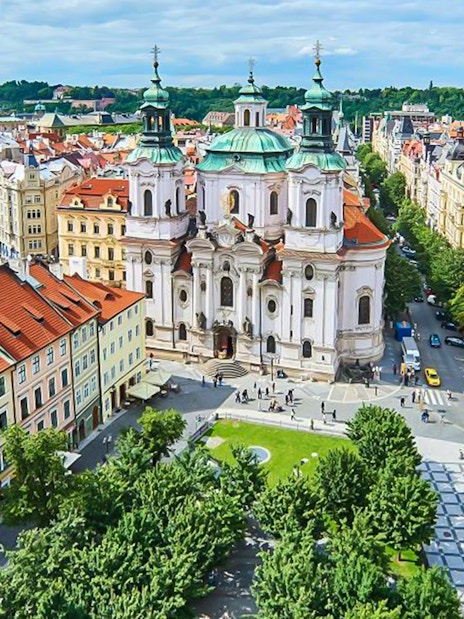 Aerial view of St. Nicholas Church and surrounding buildings in Prague's Jewish Quarters.