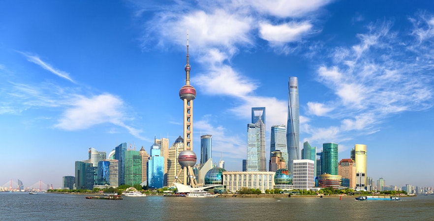 Shanghai Pudong skyline with Oriental Pearl Tower and modern skyscrapers.