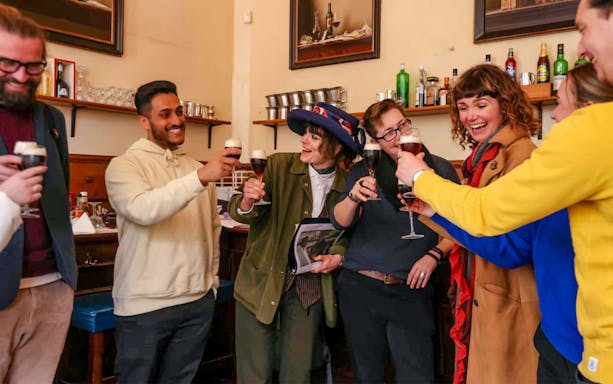 Group enjoying drinks on Eating London: Heart of 'The City' Food Tour.