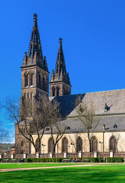 Vyšehrad Castle's twin spires and historic church in Prague, Czech Republic.