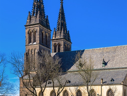 Vyšehrad Castle's twin spires and historic church in Prague, Czech Republic.