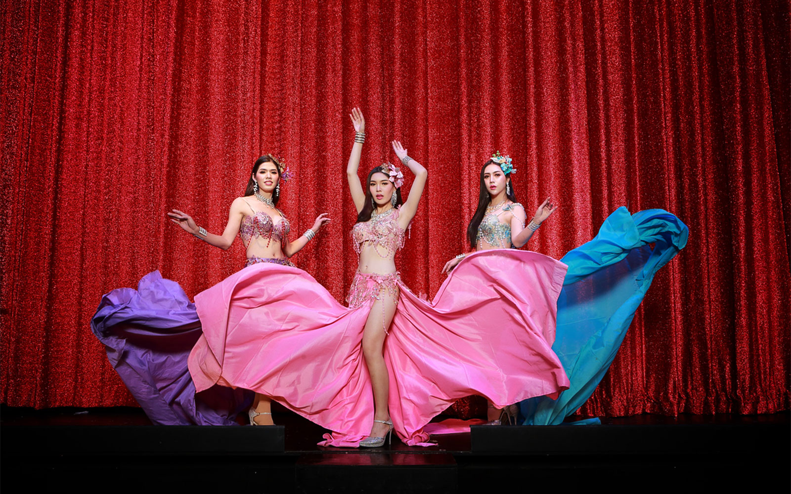 Performers in vibrant costumes at Siam Dragon Cabaret Show, Thailand.
