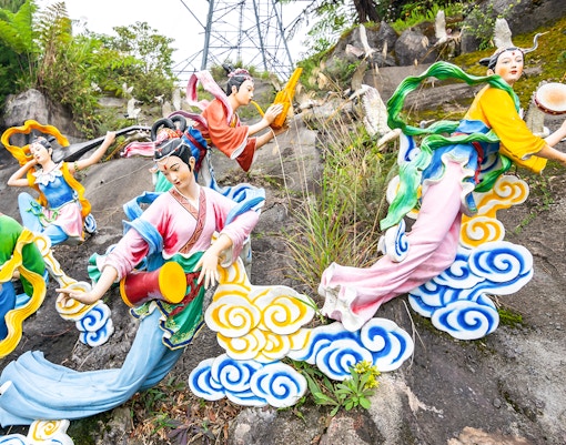Chin Swee Caves Temple pagoda with lush forest backdrop in Genting Highlands, Malaysia.