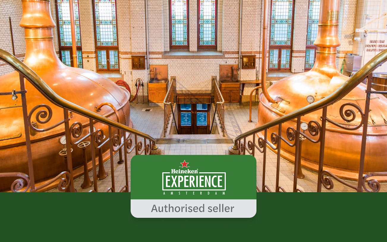 Heineken Experience interior with copper brewing tanks and stained glass windows in Amsterdam.