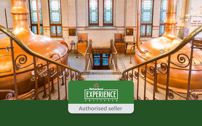 Heineken Experience interior with copper brewing tanks and stained glass windows in Amsterdam.