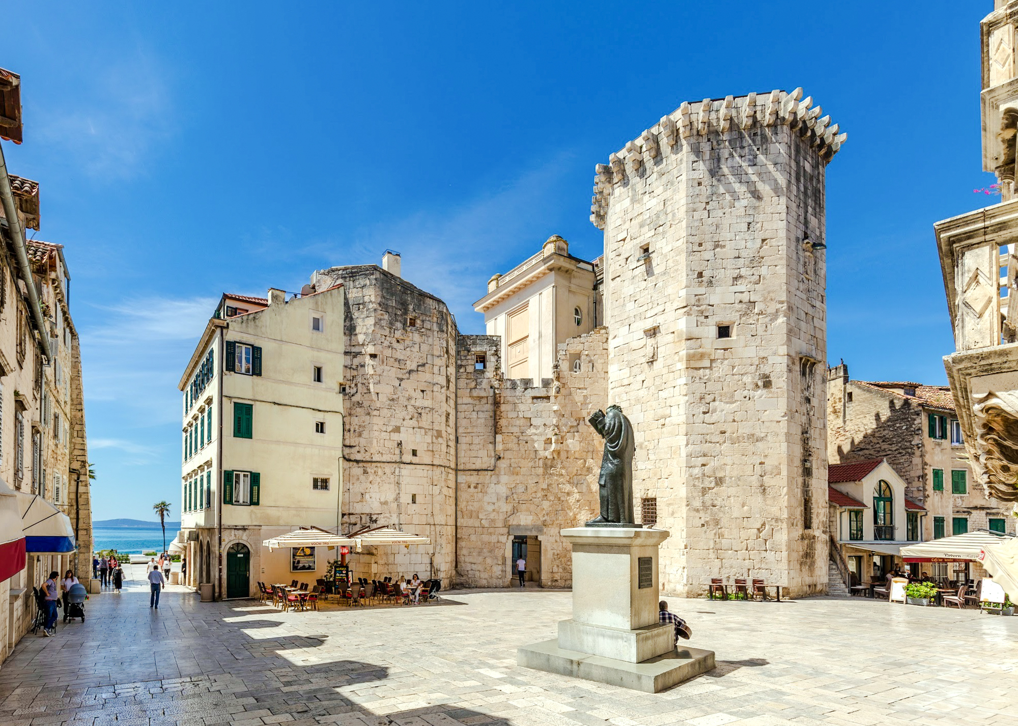 Fruit Square in Split, Croatia, featuring historic stone buildings and a central statue.