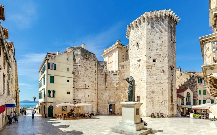 Fruit Square in Split, Croatia, featuring historic stone buildings and a central statue.