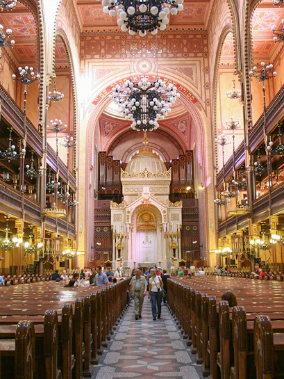 Interior of Dohany Street Synagogue in Budapest, featuring ornate architecture and chandeliers.