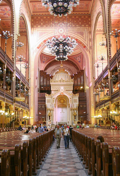 Interior of Dohany Street Synagogue in Budapest, featuring ornate architecture and chandeliers.