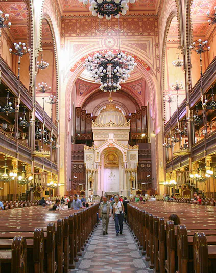 Interior of Dohany Street Synagogue in Budapest, featuring ornate architecture and chandeliers.