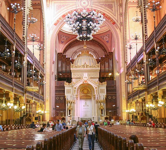 Interior of Dohany Street Synagogue in Budapest, featuring ornate architecture and chandeliers.