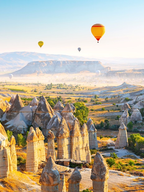 Fairy Chimneys and hot air balloons in Cappadocia, Turkey.