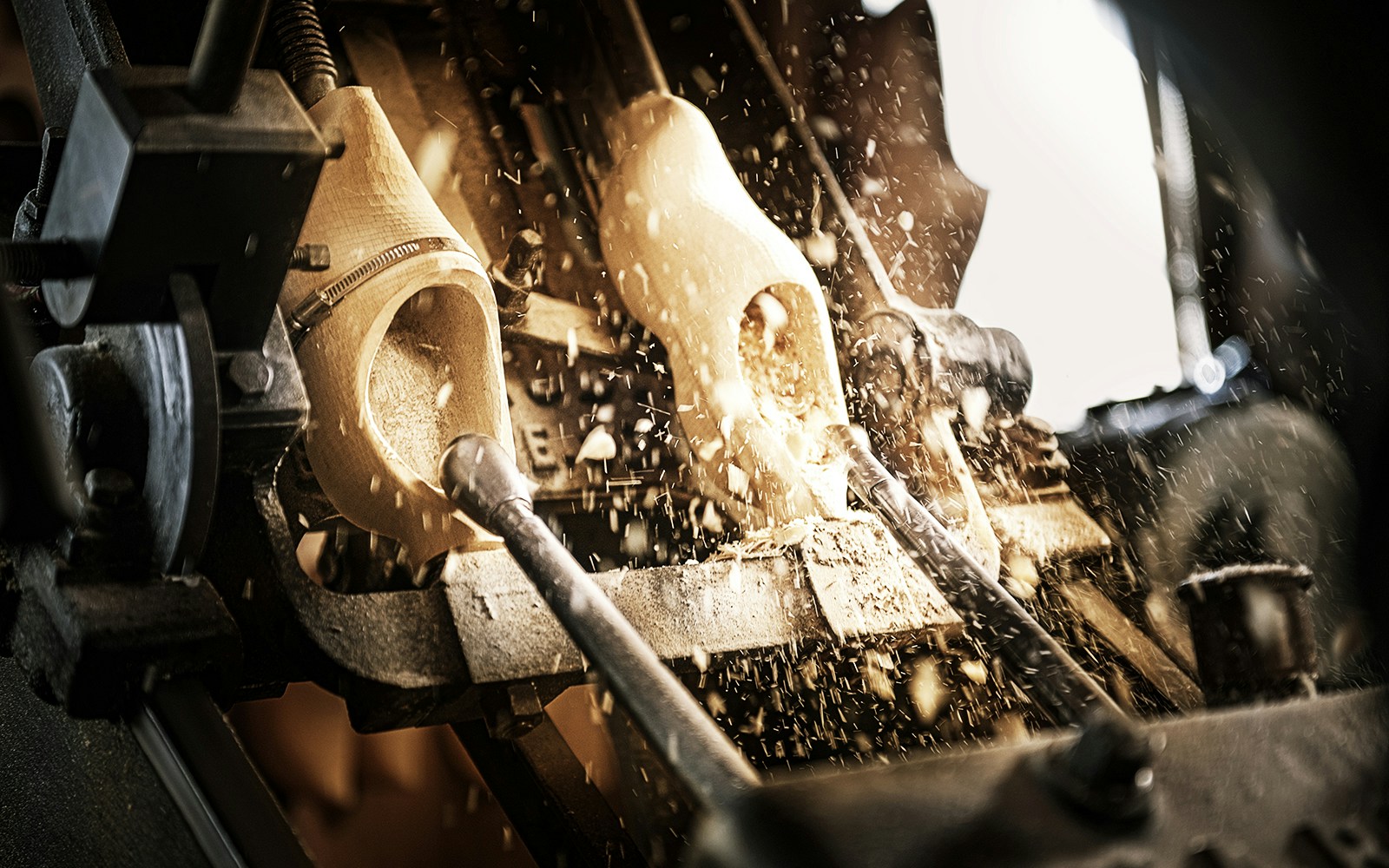 Wooden clog being crafted at Zaanse Schans workshop, Netherlands.