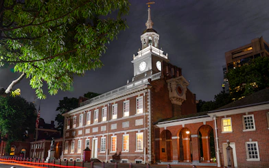 Independence Hall illuminated at night during a Philadelphia tour.