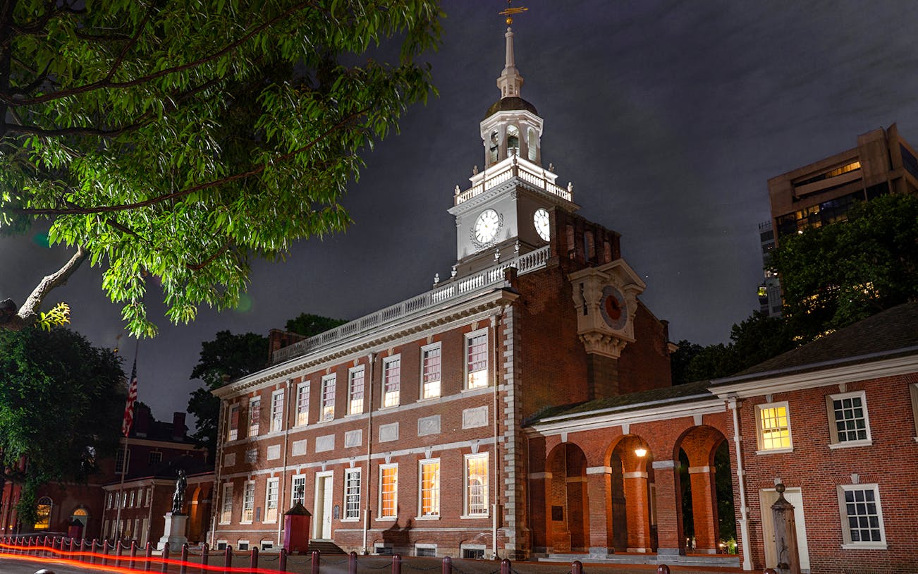 Independence Hall illuminated at night during a Philadelphia tour.