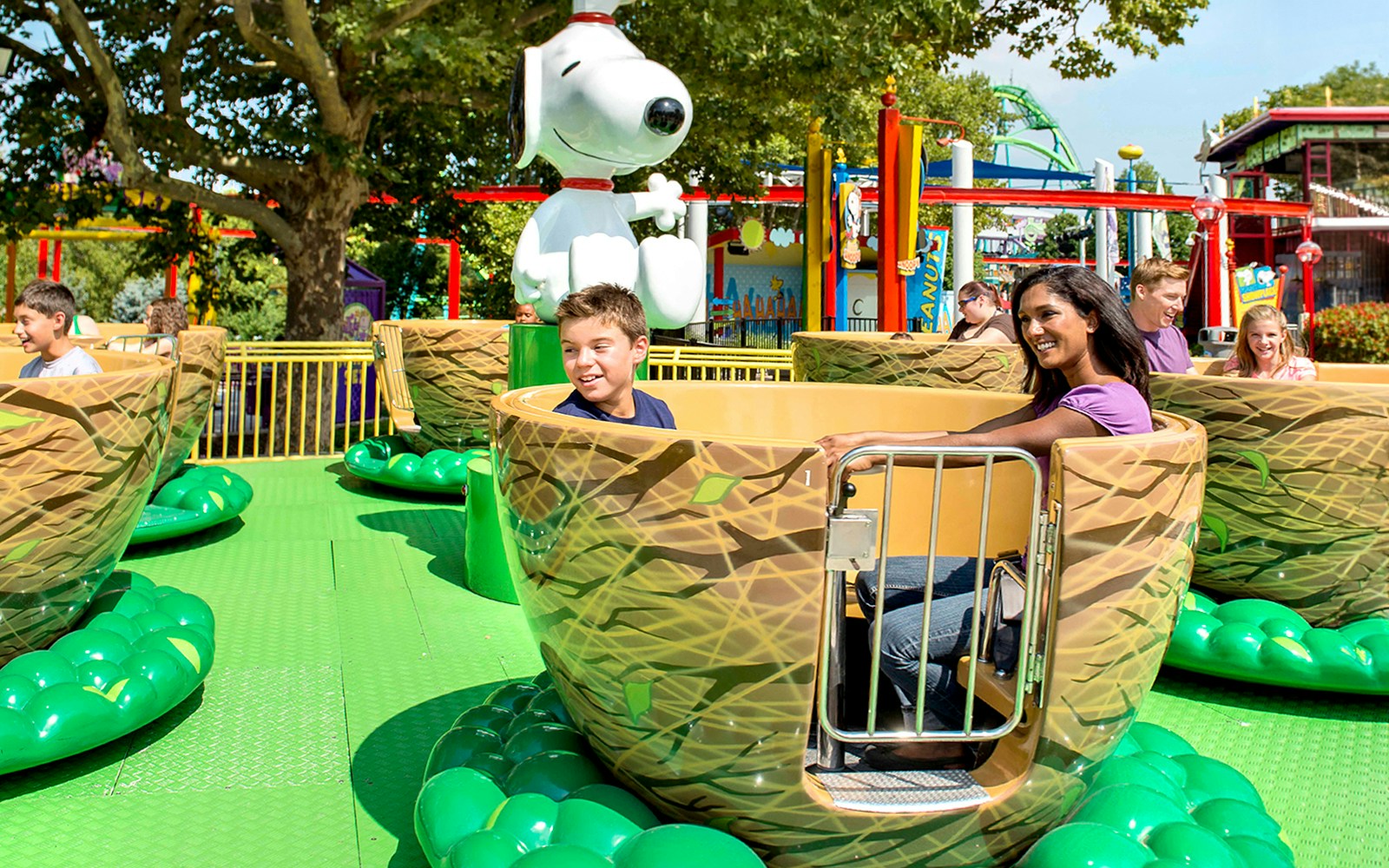 Visitors enjoying the Woodstock Whirlybirds ride at Dorney Park, featuring Snoopy.