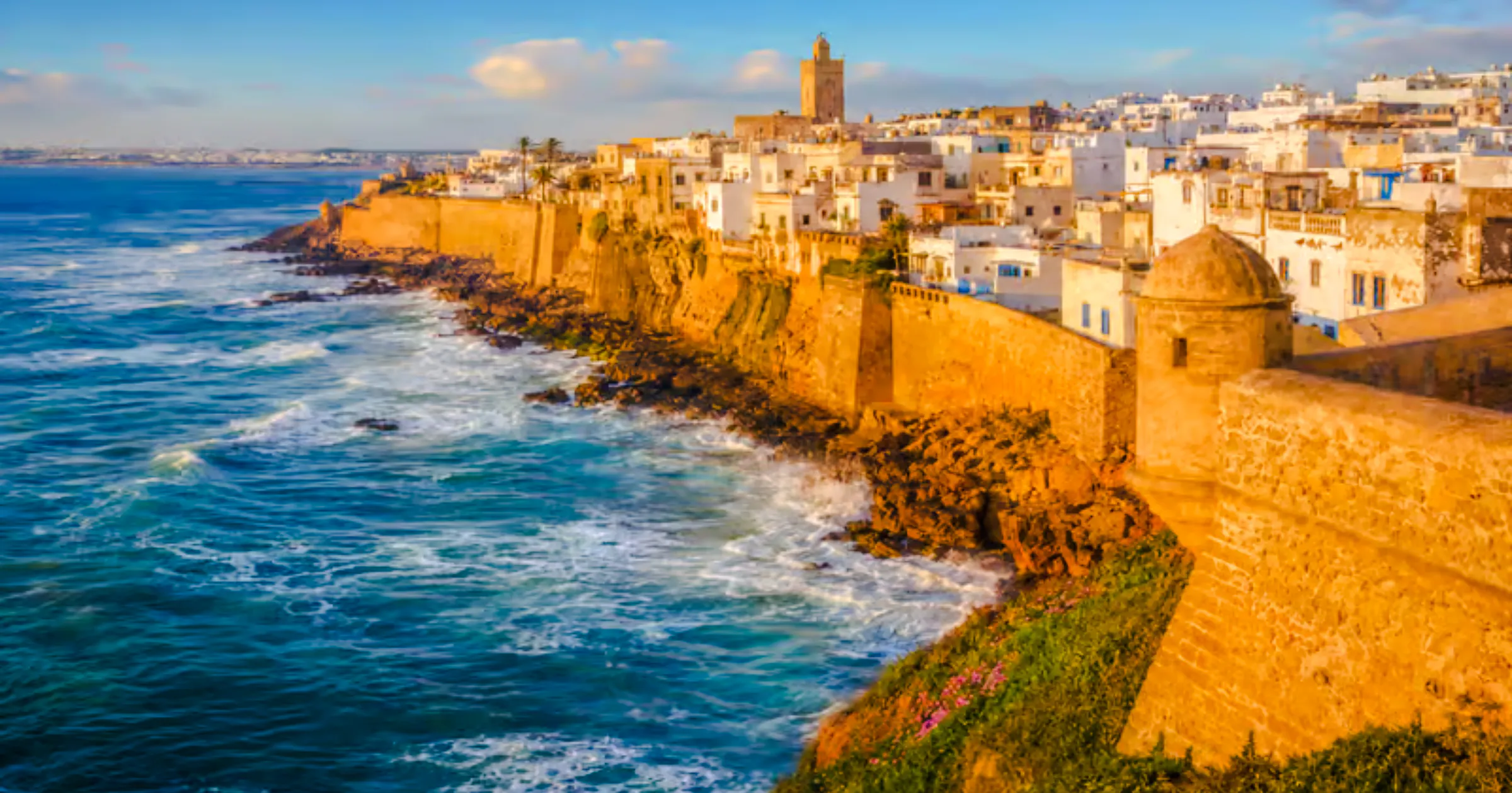 Coastal view of historic Safi city walls in Essaouira during a guided tour.