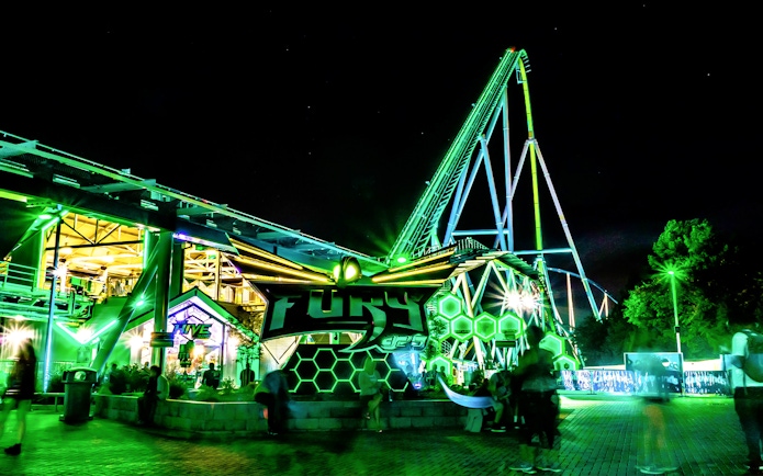 Fury 325 roller coaster at Six Flags Carowinds illuminated at night.