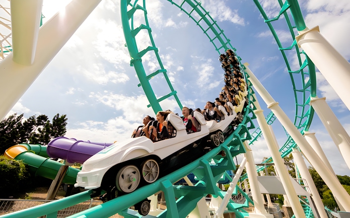 Guests riding a rollercoaster loop at Dreamworld, Gold Coast.