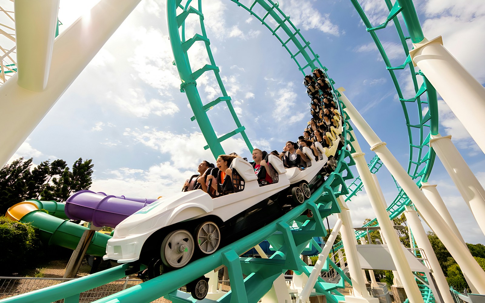 Guests riding a rollercoaster loop at Dreamworld, Gold Coast.