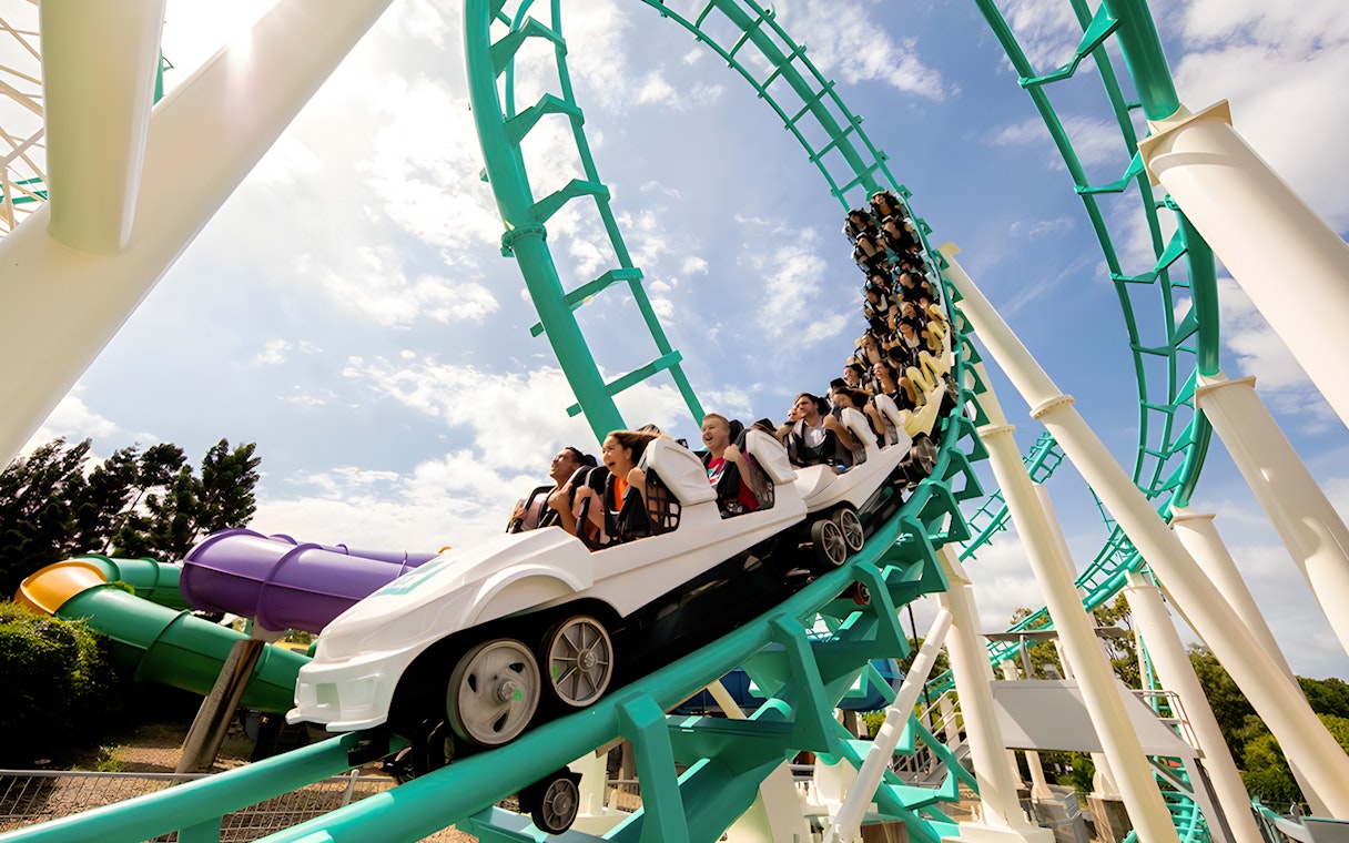 Guests riding a rollercoaster loop at Dreamworld, Gold Coast.