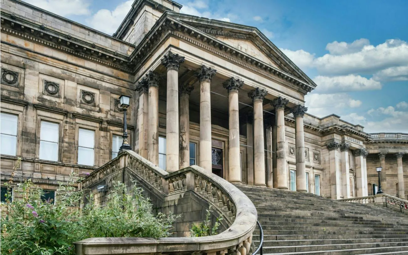 St. George's Hall entrance with columns, part of Liverpool Secret Society Detective Mystery game.