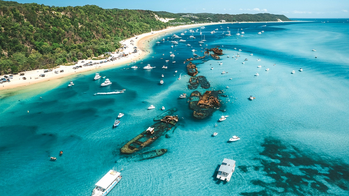 Aerial view of Tangalooma wrecks with boats in Moreton Bay, Queensland, Australia.