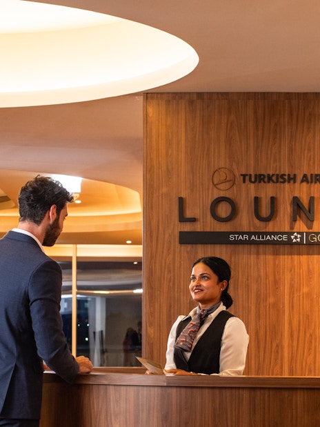 Guests checking in at Turkish Airlines Lounge, Plaza Premium Group, Edinburgh Airport.