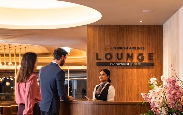 Guests checking in at Turkish Airlines Lounge, Plaza Premium Group, Edinburgh Airport.