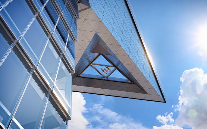 Edge Observation Deck glass floor view with sky and building reflections.