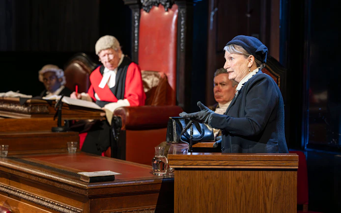 Courtroom scene from "Witness for the Prosecution" performance with actors in period costumes.