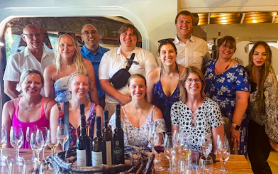 Group enjoying wine tasting on Santorini Sunset Wine Tour.