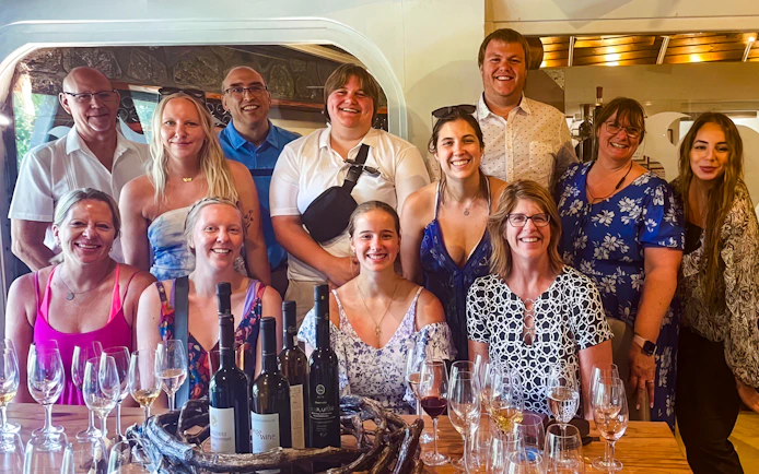 Group enjoying wine tasting on Santorini Sunset Wine Tour.