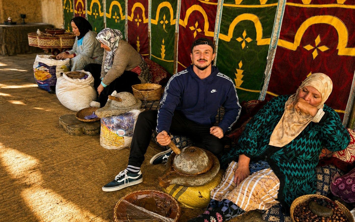 Local artisans grinding argan oil in Ourika Valley, Marrakech.