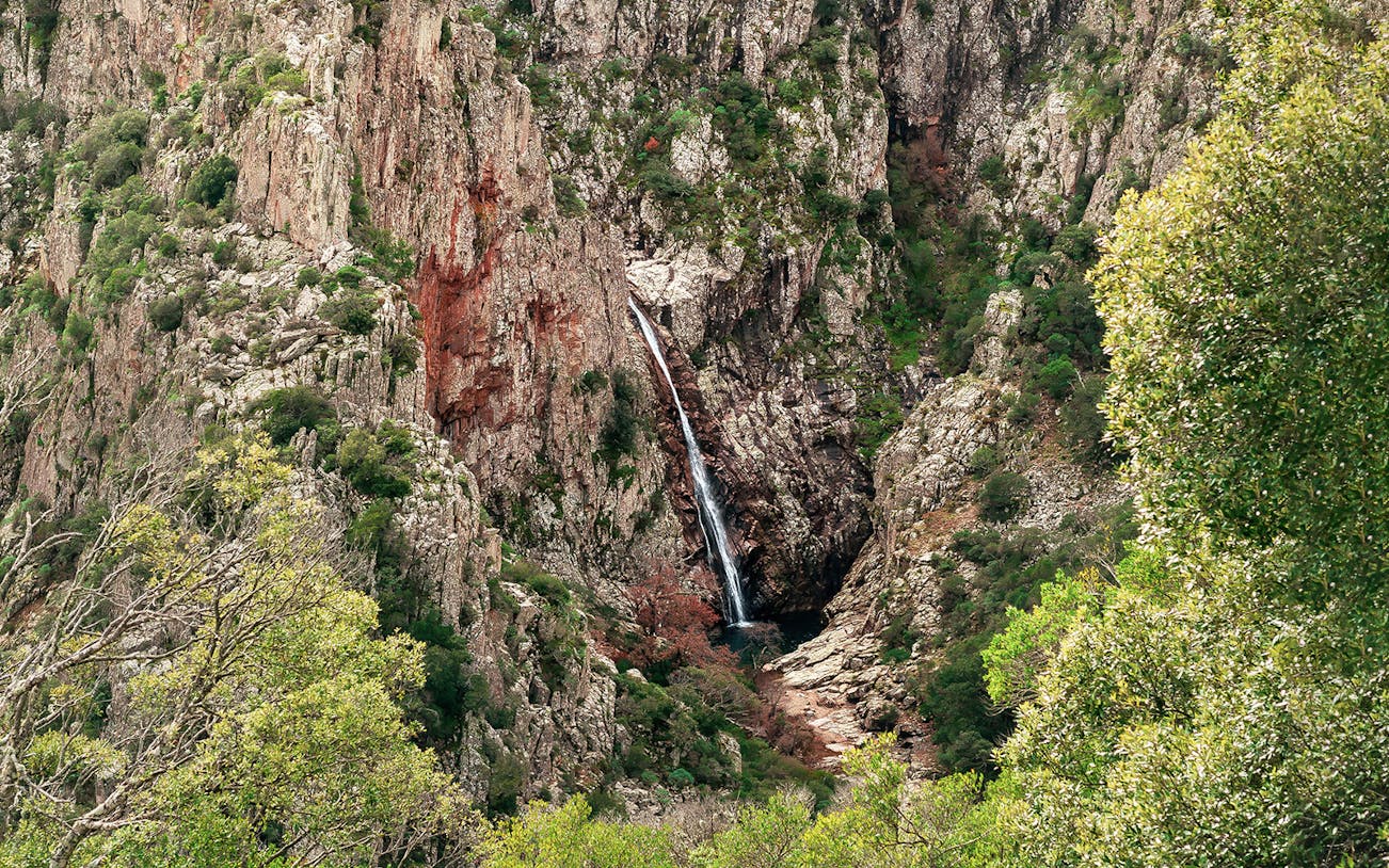 Trekking path leading to Piscina Irgas Waterfall in Villacidro, Sardinia.