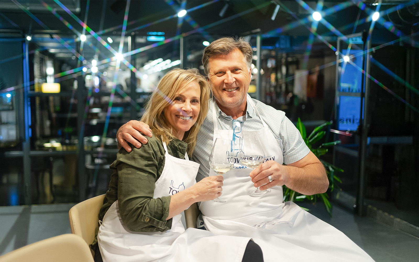 Couple enjoying wine during a pasta-making class in Florence.
