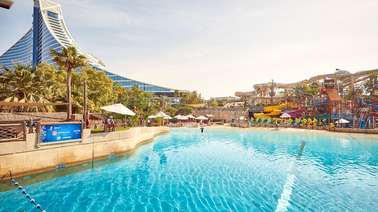 Wild Wadi Waterpark pool with slides and Jumeirah Beach Hotel in Dubai.