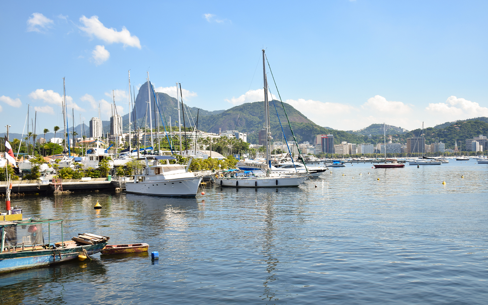 Port with sailboats and Sugarloaf Mountain in Rio de Janeiro.