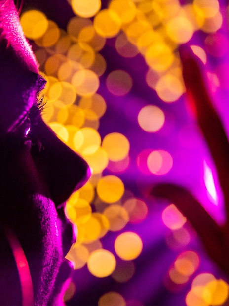 Person experiencing vibrant light display at Infinity Attraction, Gold Coast.