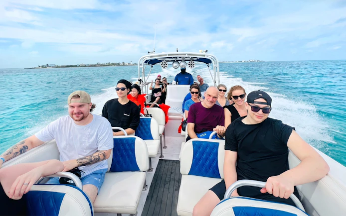 Group on a boat heading to Rose Island for a day trip with snorkeling and swimming with pigs.